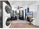 Laundry area with washer and dryer, black cabinets, and a cozy sitting space at 753 37Th S Ave, St Petersburg, FL 33705