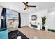 Stylish living area with fireplace, wood floors, and modern furnishings at 753 37Th S Ave, St Petersburg, FL 33705