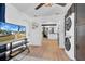 Bright living room with wood-look floors, ceiling fan, and view of the kitchen at 753 37Th S Ave, St Petersburg, FL 33705
