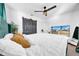 Cozy main bedroom with sliding barn door, ceiling fan, and comfortable bed at 753 37Th S Ave, St Petersburg, FL 33705