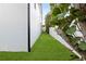 Long backyard with green grass and a white fence at 1046 Snell Isle Ne Blvd, St Petersburg, FL 33704