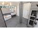 Spacious modern bathroom with walk-in shower, soaking tub, and tile flooring at 1046 Snell Isle Ne Blvd, St Petersburg, FL 33704