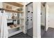 Modern bathroom with a walk-in shower, open shelving, and stylish fixtures at 1046 Snell Isle Ne Blvd, St Petersburg, FL 33704
