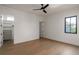 Bright, empty bedroom with walk-in closet and large window at 1046 Snell Isle Ne Blvd, St Petersburg, FL 33704
