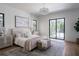 Bright, spacious bedroom with sliding glass doors to balcony at 1046 Snell Isle Ne Blvd, St Petersburg, FL 33704