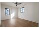 Bright bedroom with wood-look flooring and multiple windows at 1046 Snell Isle Ne Blvd, St Petersburg, FL 33704