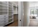 Spacious walk-in closet with built-in shelving and drawers at 1046 Snell Isle Ne Blvd, St Petersburg, FL 33704
