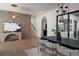 Dining area with a black table, modern chandelier, and a view into the adjacent kitchen at 1046 Snell Isle Ne Blvd, St Petersburg, FL 33704