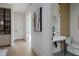 Powder room with a pedestal sink and contemporary design at 1046 Snell Isle Ne Blvd, St Petersburg, FL 33704