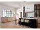 Stylish kitchen with a black island, ample counter space, and wood cabinetry at 1046 Snell Isle Ne Blvd, St Petersburg, FL 33704