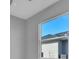 Bedroom with gray walls, a ceiling fan, and a window offering a view at 243 Rotonda S Blvd, Rotonda West, FL 33947