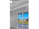 Bedroom with sliding glass doors opening to a pool and backyard views at 243 Rotonda S Blvd, Rotonda West, FL 33947