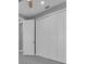 Bedroom with large white closet and gray flooring at 243 Rotonda S Blvd, Rotonda West, FL 33947