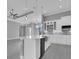 Spacious kitchen featuring an island with farmhouse sink, modern appliances, and ample counter space at 243 Rotonda S Blvd, Rotonda West, FL 33947