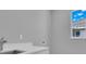 Laundry room with white countertop, sink, and window at 243 Rotonda S Blvd, Rotonda West, FL 33947