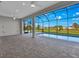 Screened-in pool and patio area overlooking a grassy backyard at 243 Rotonda S Blvd, Rotonda West, FL 33947