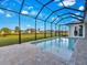 Spacious screened-in pool area with view of neighboring homes at 243 Rotonda S Blvd, Rotonda West, FL 33947