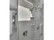 Modern shower with gray tile, a built-in niche, and a rainfall showerhead at 243 Rotonda S Blvd, Rotonda West, FL 33947
