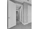 Bright hallway with gray walls and white doors at 255 Rotonda S Blvd, Rotonda West, FL 33947