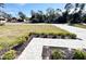 Front yard with paver walkway and landscaping at 1153 Chalmer Ter, Port Charlotte, FL 33953