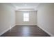 Empty bedroom with dark wood-style flooring and neutral walls, ready for personalization at 2550 Mauritania Rd, Punta Gorda, FL 33983