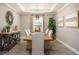 Dining room featuring a large table, modern light fixture, and decorative accents at 2550 Mauritania Rd, Punta Gorda, FL 33983