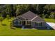 Charming two-story home with stone and siding accents, large front yard and lush landscape at 2550 Mauritania Rd, Punta Gorda, FL 33983