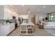 Spacious kitchen with island, white cabinets, pendant lighting, and stainless steel appliances at 2550 Mauritania Rd, Punta Gorda, FL 33983
