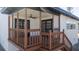 Elevated wooden deck with railing, stairs, and access to the main living area at 809 59Th Ave, St Pete Beach, FL 33706