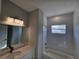 Modern bathroom with white vanity, tiled shower, and sleek fixtures at 1262 Oxsalida St, Port Charlotte, FL 33952