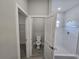 View of the bathroom showing the toilet, walk-in shower, and walk-in closet at 1262 Oxsalida St, Port Charlotte, FL 33952