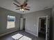 Bright, empty bedroom with tile flooring, ceiling fan, and closet at 1262 Oxsalida St, Port Charlotte, FL 33952