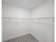Empty walk-in closet with wire shelving and wood-look tile flooring at 1262 Oxsalida St, Port Charlotte, FL 33952