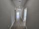 Hallway with tile flooring and doorways leading to other rooms at 1262 Oxsalida St, Port Charlotte, FL 33952