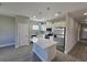 Modern kitchen with white cabinets, stainless steel appliances, an island with white quartz counters, and pendant lights at 1262 Oxsalida St, Port Charlotte, FL 33952