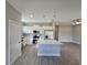 Open concept kitchen and living area with white cabinets, stainless steel appliances, and tile flooring at 1262 Oxsalida St, Port Charlotte, FL 33952