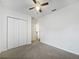 Bedroom with carpet, white closet doors, ceiling fan and white walls at 2061 Willow Hammock Cir # 107, Punta Gorda, FL 33983