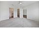 Bedroom with carpeting, an open door to a closet, and an ensuite bathroom at 2061 Willow Hammock Cir # 107, Punta Gorda, FL 33983