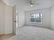 Unfurnished bedroom with plush carpet and a large window at 2061 Willow Hammock Cir # 107, Punta Gorda, FL 33983