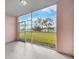 Screened patio with views of a grassy common area at 2061 Willow Hammock Cir # 107, Punta Gorda, FL 33983