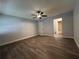Spacious bedroom with wood-look flooring and access to a bathroom at 314 Spring Lakes Blvd # 314-U, Bradenton, FL 34210