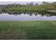 Scenic view of lake with lush green landscape at 314 Spring Lakes Blvd # 314-U, Bradenton, FL 34210