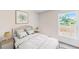 Bright and airy bedroom with a comfortable bed and natural light at 2184 Hyatt Dr, Port Charlotte, FL 33948