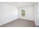 Unfurnished bedroom with neutral carpet and a single window at 2184 Hyatt Dr, Port Charlotte, FL 33948