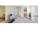 Primary bedroom with walk-in closet, ensuite bathroom, and blue and white bedding at 2184 Hyatt Dr, Port Charlotte, FL 33948