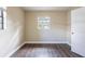 Well-lit bedroom with wood-look floors and a window at 3723 N Garrison St, Tampa, FL 33619