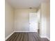 Empty bedroom with hardwood floors and neutral walls at 3723 N Garrison St, Tampa, FL 33619