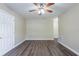 Spacious bedroom with hardwood floors and neutral walls at 3723 N Garrison St, Tampa, FL 33619