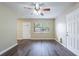 Bright living room with hardwood floors and ceiling fan at 3723 N Garrison St, Tampa, FL 33619