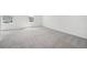 Empty bedroom with gray carpeting and white walls, ready for personalization at 4280 Banjo Lake Rd, Land O Lakes, FL 34639